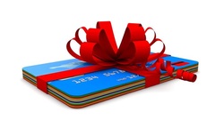 Stack of gift cards wrapped in a red bow